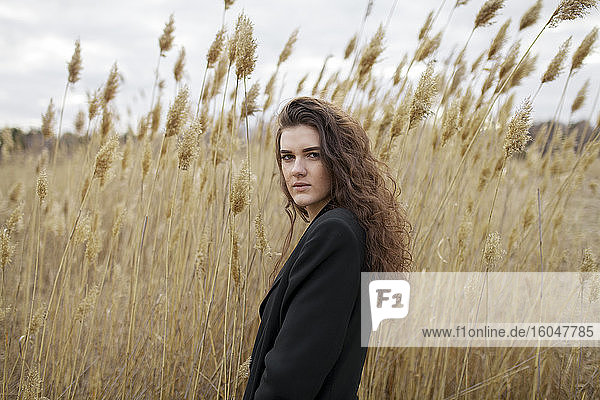Russia  Omsk  Portrait of young woman in tall grass