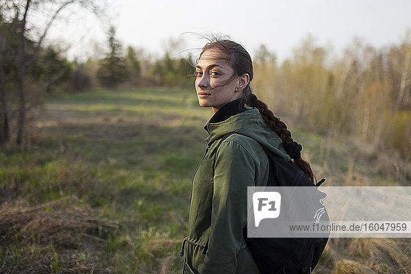 Russia  Omsk  Young woman in meadow