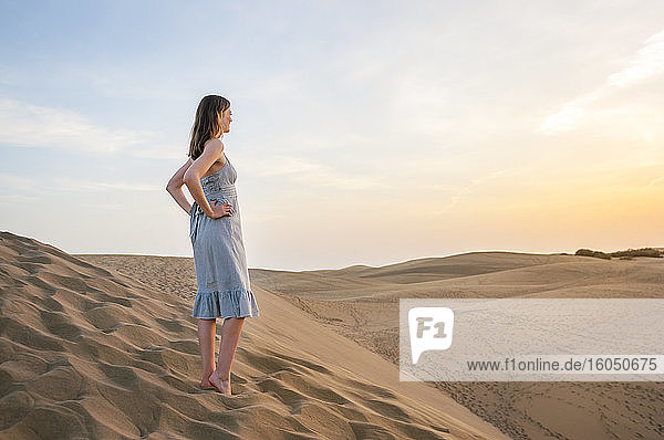 Woman at sunset in the dunes  Gran Canaria  Spain