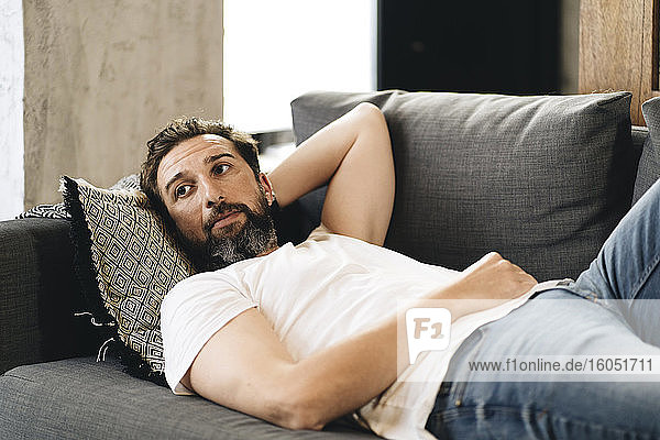Mature man lying on couch  relaxing