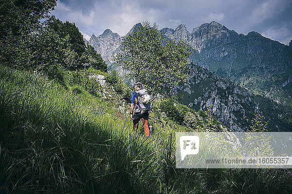 Hiker walking on mountain path  Orobie  European Alps  Como  Italy