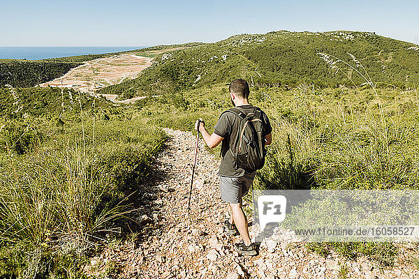 Hiker on stony hiking trail