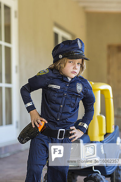 4 year old boy dressed as a police officer