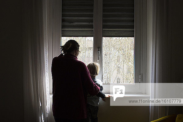 Child and mom at window