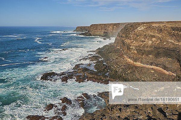 Rocky coast with strong surf  cliffs on the beach of La Huesilla  Fuerteventura  Canary Islands  Spain  Europe