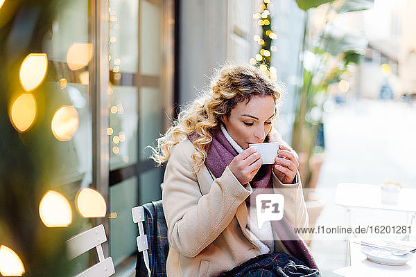 Woman having hot drink at cafe  Firenze  Toscana  Italy