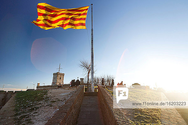 Catalan flag on Monthuic Castle on Montjuic hill, Barcelona, Spain