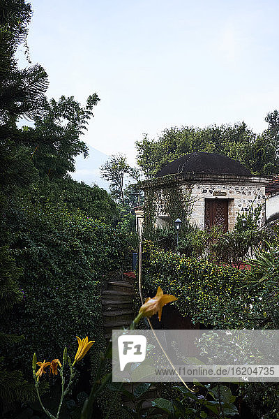 Garden with domed roof building, Antigua, Guatemala