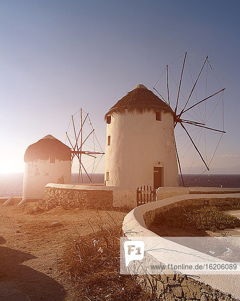 Two traditional windmills on coast, Mykonos, Cyclades, Greece