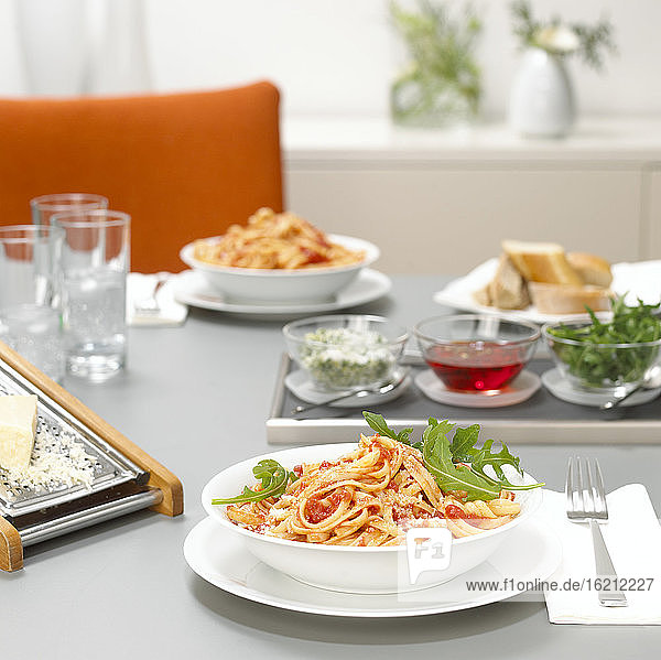 Lunch for two  pasta with tomato sauce and rocket
