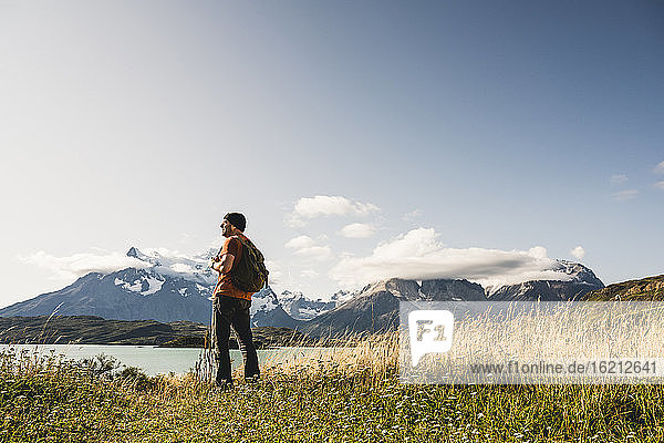 Man standing at Lake Pehoe in Torres Del Paine National Park  Chile Patagonia  South America