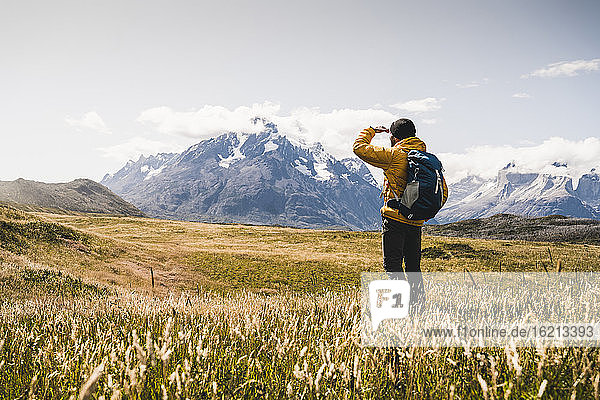 Man looking at view while exploring Torres Del Paine National Park in Patagonia  South America