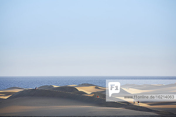 Spain  Gran Canaria  Playa del Ingles  Tourist on sand dunes of maspalomas