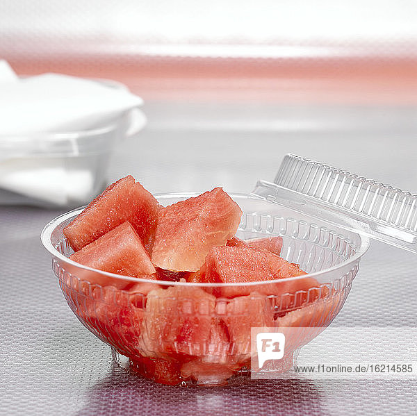 Watermelon slices in plastic bowl  close-up