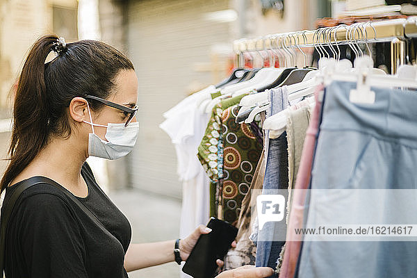 Woman with protective mask shopping