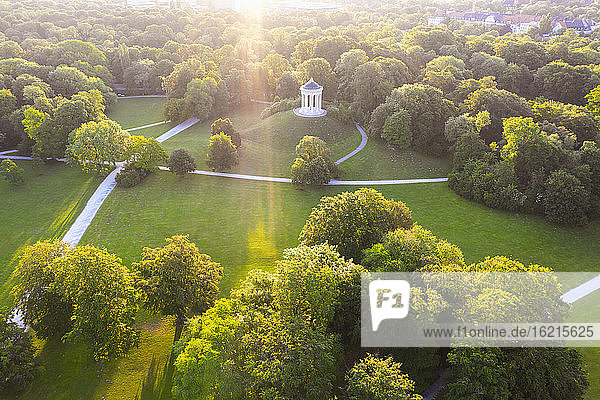 Germany  Bavaria  Munich  Aerial view of Monopteros in English Garden at sunset