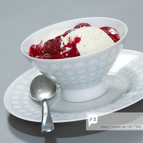 Vanilla ice cream with raspberries  close-up