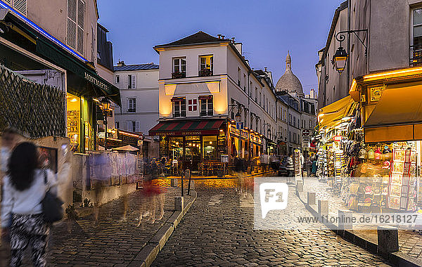 Tourists walking on street of Montmartre in Paris  France