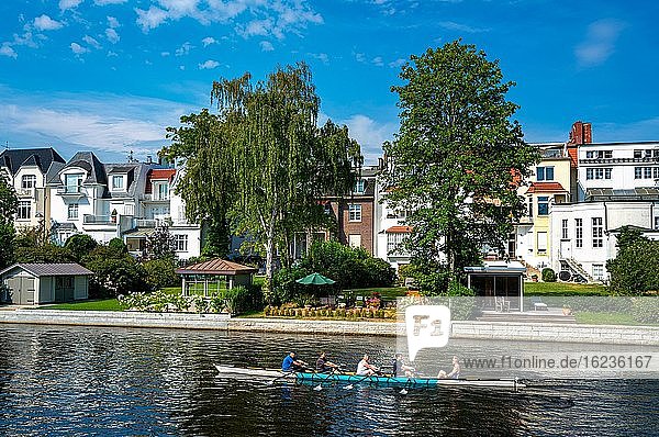 Rowing boat with recreational athletes on the Alster in Hamburg Winterhude  Hamburg  Germany  Europe