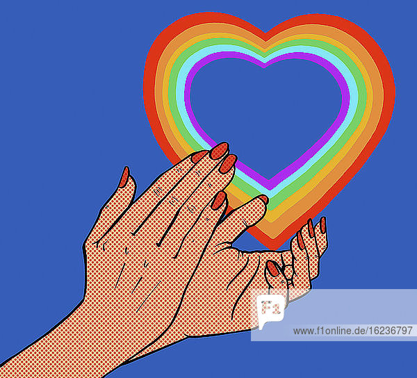 Nahaufnahme von klatschenden Händen und Regenbogenherz