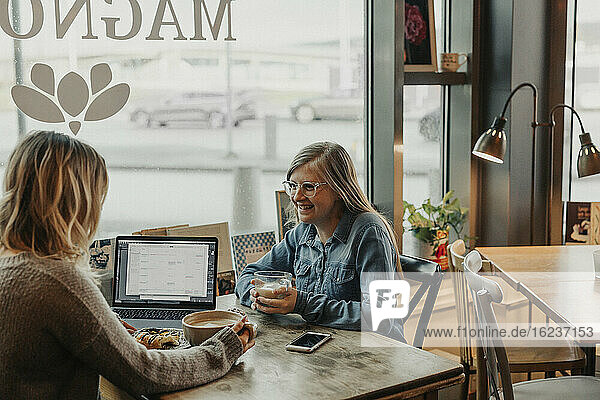 Women having coffee in cafe