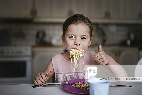 Smiling eating spaghetti
