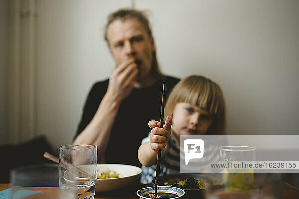 Father and daughter having meal