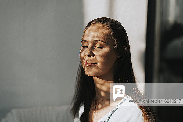 Woman relaxing with her eyes closed