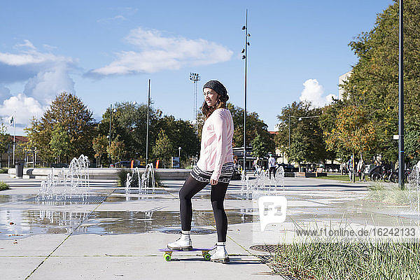 Young woman with skateboard