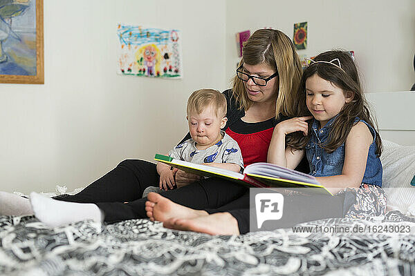Mother reading with kids