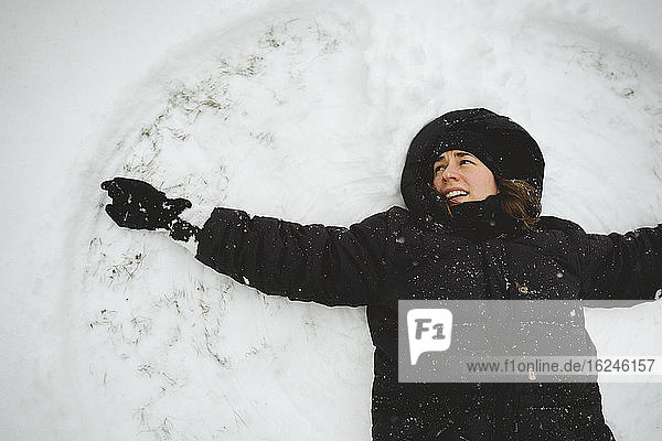 Woman doing snow angel