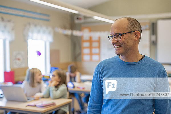 Smiling teacher in classroom