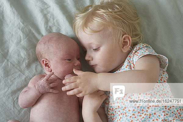 Girl with baby sibling