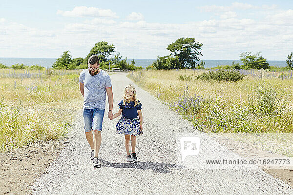 Father and daughter walking together