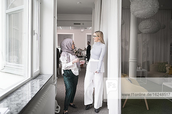 Two women working in office