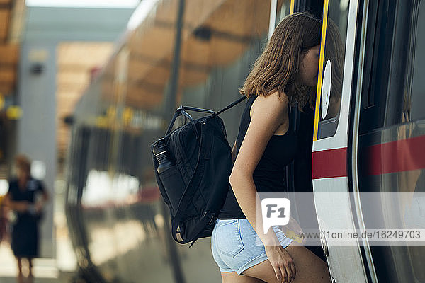 Woman entering train