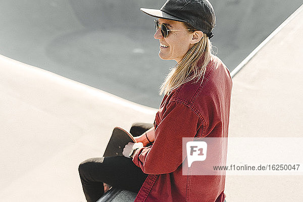 Smiling woman at skate park