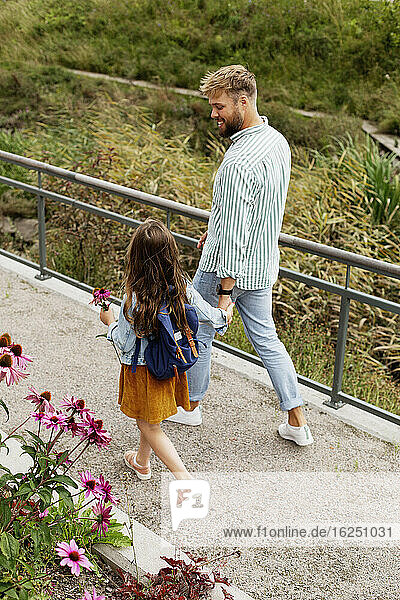 Father walking with daughter