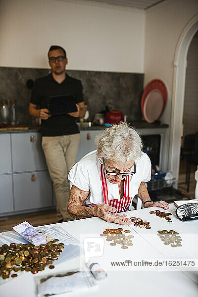 Woman counting coins
