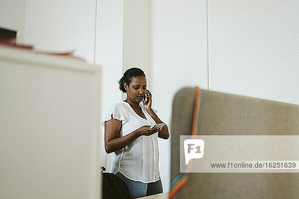Woman on the phone in office