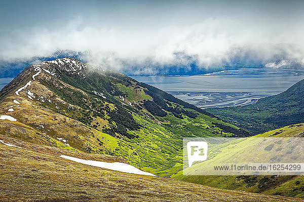 View of Bird Ridge and Turnagain Arm under clouds  Chugach State Park  South-central Alaska in summertime; Alaska  United States of America