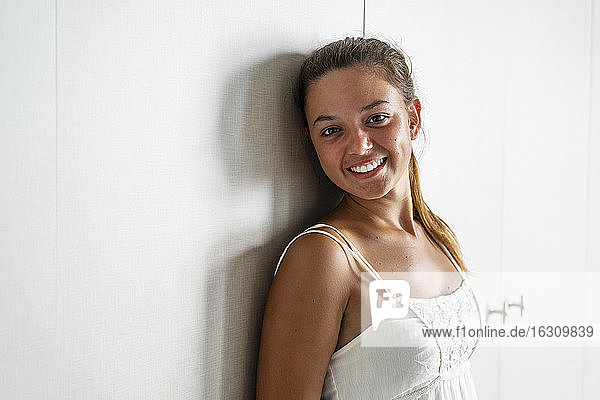 Beautiful smiling woman standing at home