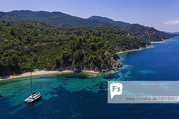 Aerial by drone of a sailing boat on Zografou Beach  Sithonia  Greece  Europe
