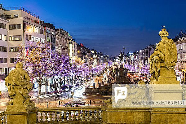 Christmas decorations and markets through statues of National Museum at Wenceslas Square  New Town  Prague  Czech Republic  Europe