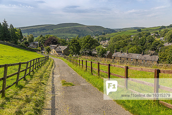 View of Hayfield including St. Mathews Church and hills surrounding village  High Peak  Derbyshire  England  United Kingdom  Europe