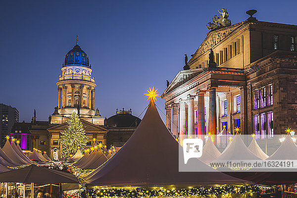 Germany  Berlin  Christmas market at Gendarmenmarkt in front of the Concert Hall right and German Cathedral
