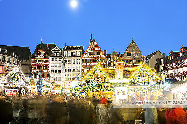 Germany  Frankfurt  Christmas market at Roemerberg with view to Ostzeile at moonlight