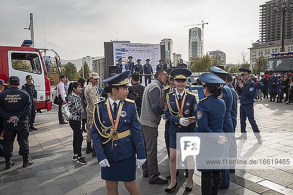 Honoring graduates of various schools and academies on Sukhbaatar Square with Genghis Khan monument  center of Ulan Bator  Mongolia  Asia