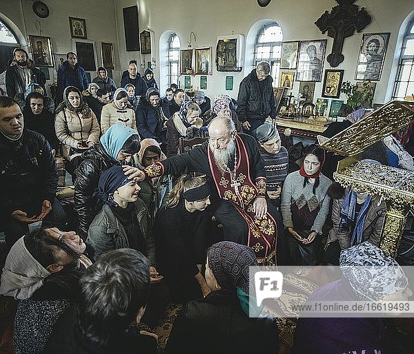 Father Sergei during an exorcism in his church in Ochamchira. He is widely known as an exorcist and receives people seeking help from all over Russia  Ochamchira  Abkhazia  Georgia  Asia