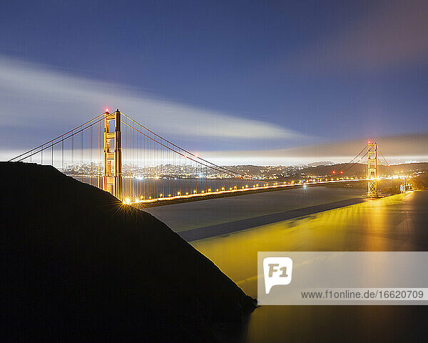 Glowing Golden Gate Bridge at night in San Francisco  California  USA